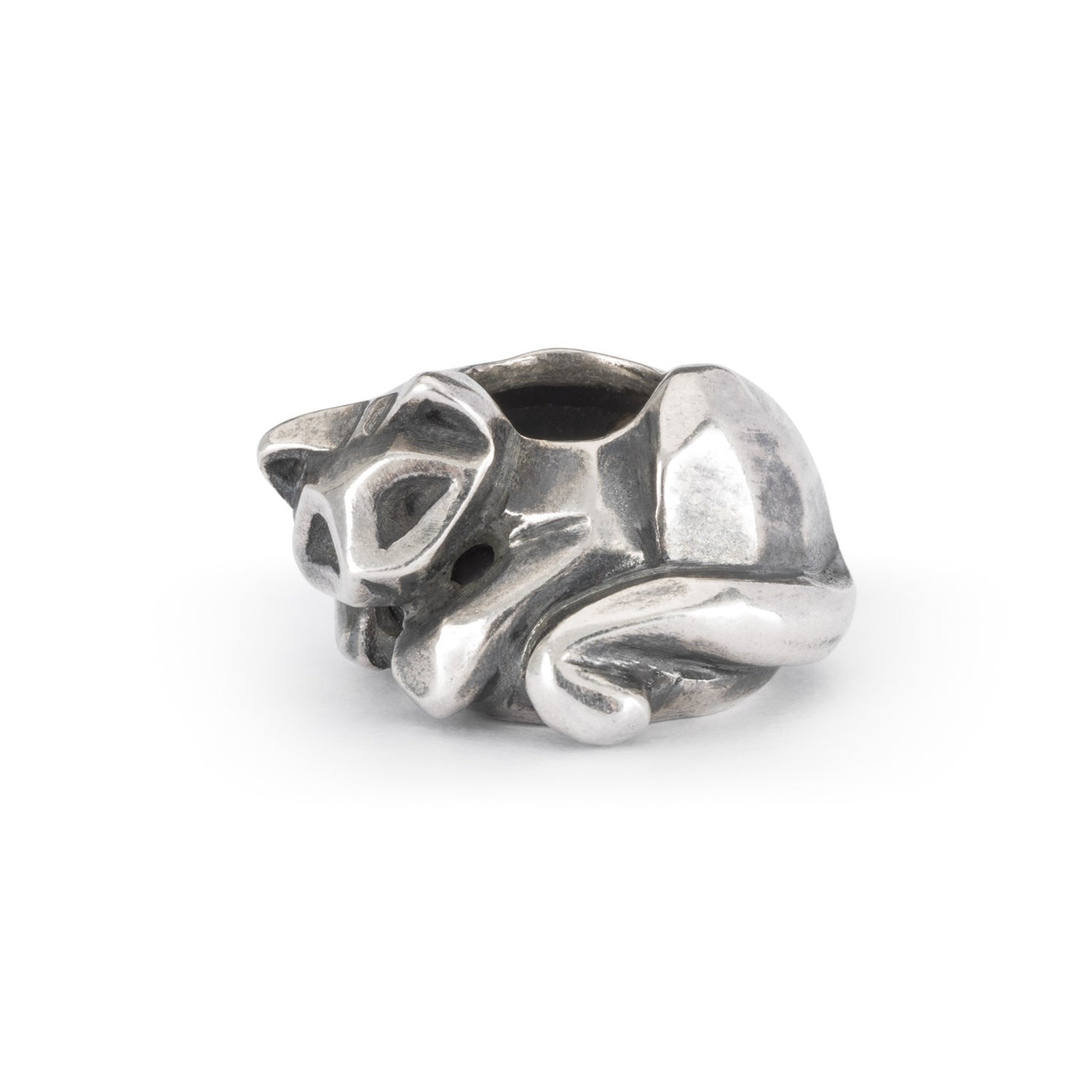 a silver jewellery spacer bead showing a cat curled up for a nap.