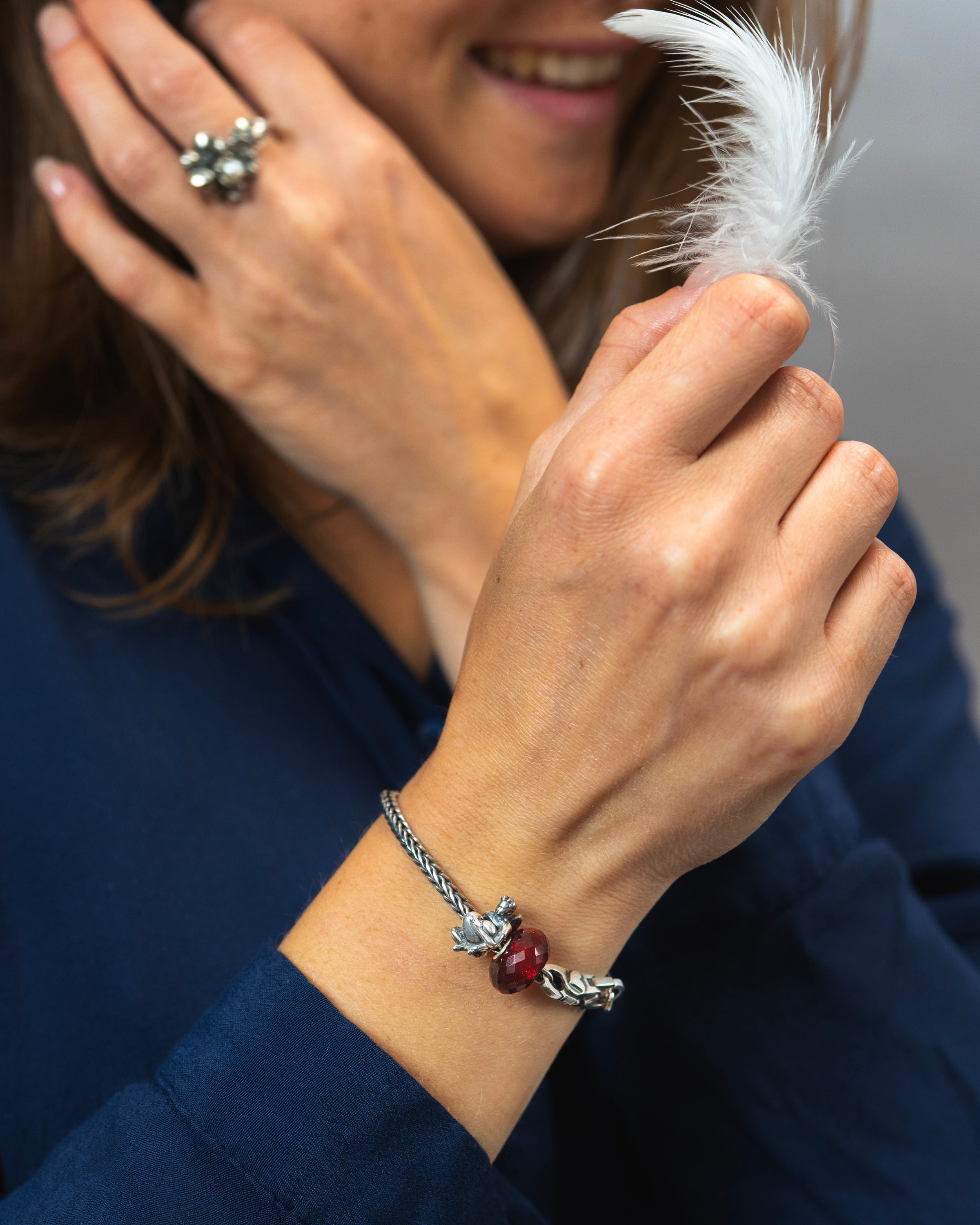 Model wearing christmas bracelet Guardian Angel in silver with red glass bead