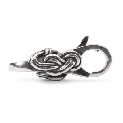 Flamsk knob lås - En lås i sterlingsølv formet som et dekorativt knude, der tilføjer en fin detalje til dit Trollbeads-armbånd.